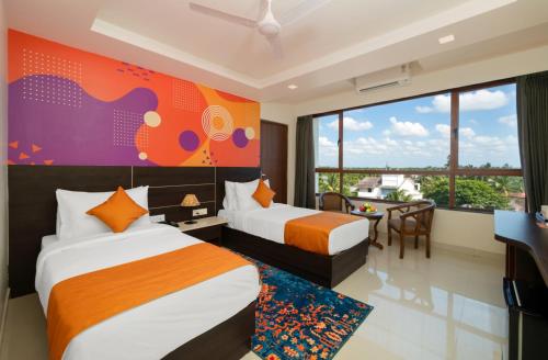 Ένα ή περισσότερα κρεβάτια σε δωμάτιο στο Ira by Orchid Porvorim Goa