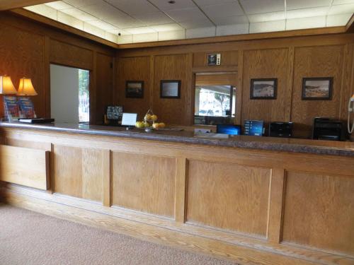 a bar in a waiting room with wood paneling at Cow Hollow Inn and Suites in San Francisco