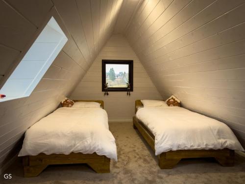 En eller flere senge i et værelse på Casa Aproape de Stele din Beliș, Apuseni