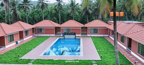 Πισίνα στο ή κοντά στο Oscar club farmhouse and Resorts