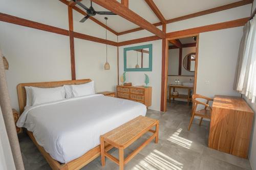 Ένα ή περισσότερα κρεβάτια σε δωμάτιο στο Villa Pantai Surga