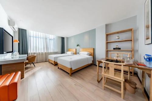Ένα ή περισσότερα κρεβάτια σε δωμάτιο στο Jin Yi Chain Hotel Agricultural University Branch