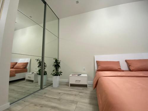 Postel nebo postele na pokoji v ubytování Елітні апартаменти в центрі міста ЖК Театральний,парковка