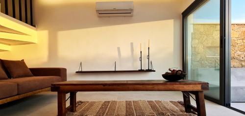 a living room with a couch and a table at Phaedrus Living Venus Seaview Lighthouse Villa in Paphos