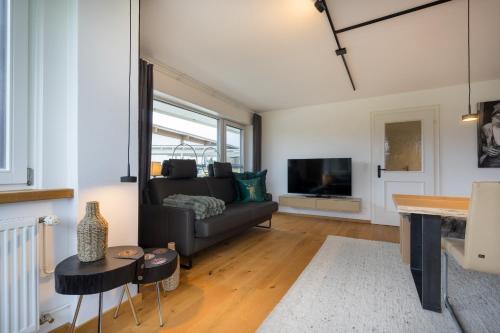 TV a/nebo společenská místnost v ubytování Ferienwohnungen Alpentraum - W 38