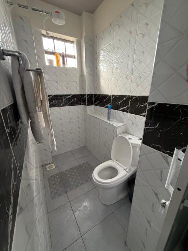 Ένα μπάνιο στο B106 -Aries Luxe Suites 1 Bedroom