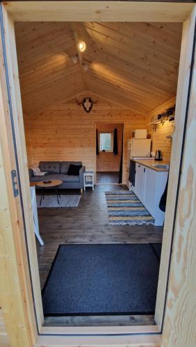 a view of the living room and kitchen of a tiny house at Webers Tiny House in Rentjärn