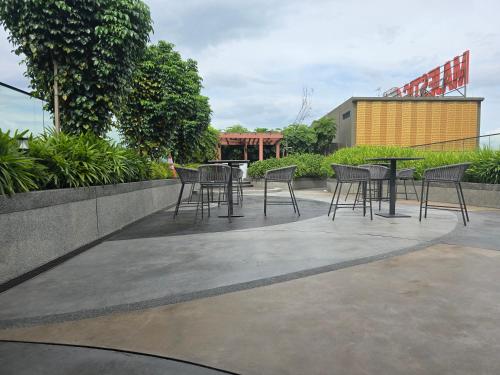 a group of chairs and tables on a patio at City centre Majestice Suite KLCC in Kuala Lumpur