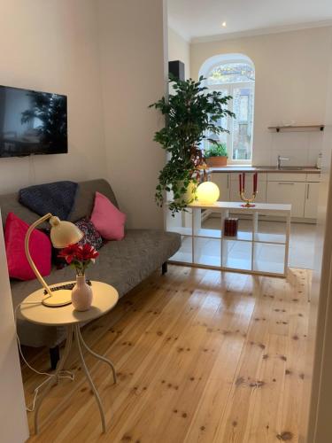a living room with a couch and a table at Ferienwohnung Wethmüller in der Altstadt in Rinteln