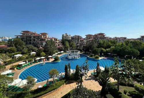 an overhead view of a swimming pool in a resort at Poseidon Nessebar Private Apartment in Nesebar