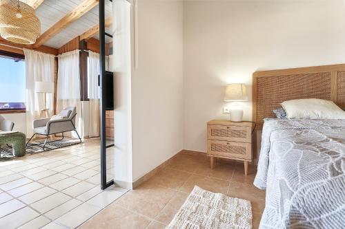 En eller flere senge i et værelse på Casa Alegria