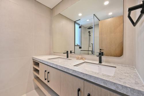 a bathroom with a sink and a mirror at Golden Stays - Luxe 4BR Villa Family-Friendly and Fully Equipped in Dubai