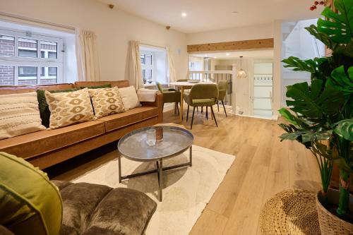 a living room with a couch and a table at Appartement B Rosita in Twisk