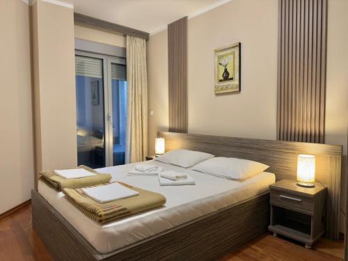 Ένα ή περισσότερα κρεβάτια σε δωμάτιο στο Beachfront Apartments Oaza 2