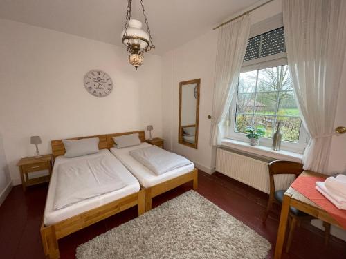 Ένα ή περισσότερα κρεβάτια σε δωμάτιο στο Landhaus Holthausen