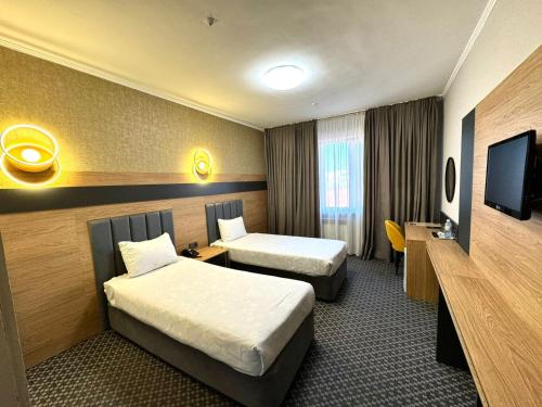 Postel nebo postele na pokoji v ubytování Golden Palace Hotel