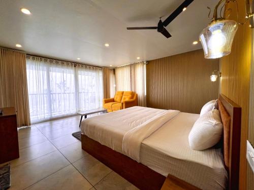 Ένα ή περισσότερα κρεβάτια σε δωμάτιο στο Hornbill Resorts