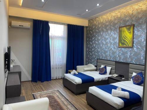 Postel nebo postele na pokoji v ubytování Vatan Hotel