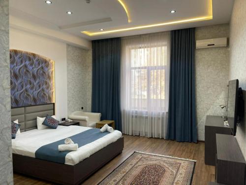 Ένα ή περισσότερα κρεβάτια σε δωμάτιο στο Vatan Hotel