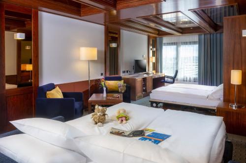 Postel nebo postele na pokoji v ubytování Maritim Hotel Darmstadt