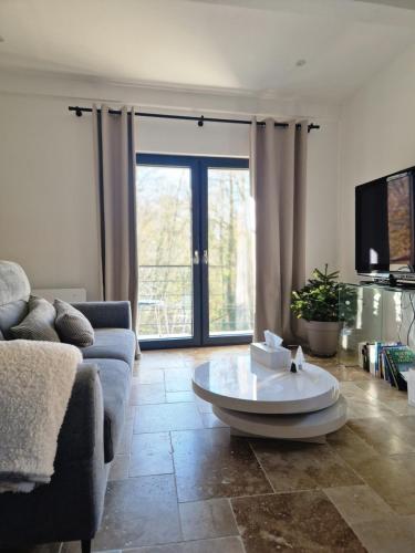 Un lugar para sentarse en Gîte VITAL Rivière - Charming cottage