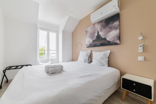 En eller flere senge i et værelse på Noisy Villiers sur Marnes