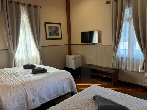 Postel nebo postele na pokoji v ubytování Noom Guesthouse