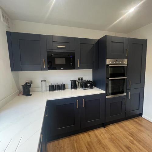 Kuchyň nebo kuchyňský kout v ubytování Stylish family home with cinema-style lounge near Blackpool