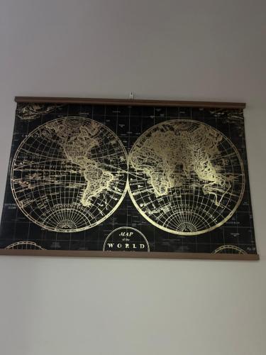 an old map of the world on a wall at Paragraph Tottenham in Southgate