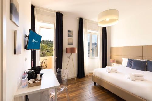 Ένα ή περισσότερα κρεβάτια σε δωμάτιο στο Mapi’s Rooms