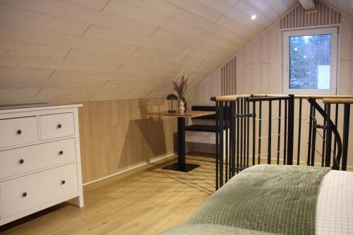 Ένα ή περισσότερα κρεβάτια σε δωμάτιο στο Das Atelier im Kalterbach