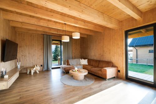 a living room with a couch and a table at Forest360 in Liptovský Mikuláš