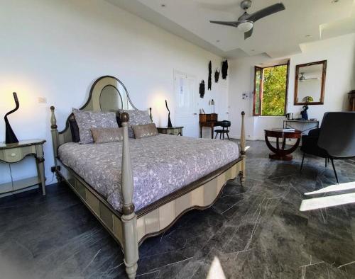 a bedroom with a large bed in a room at Les Hauts de Domme - Chambres d'hôtes in Domme