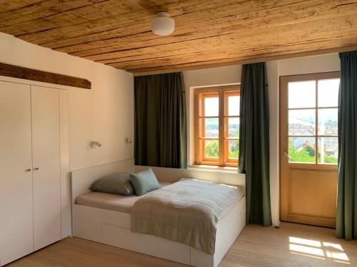 a bedroom with a bed and a window at kremsoase in Krems an der Donau