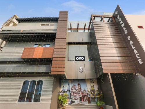 a building with an om sign on the front of it at Super Hotel O Centrum in Gorakhpur