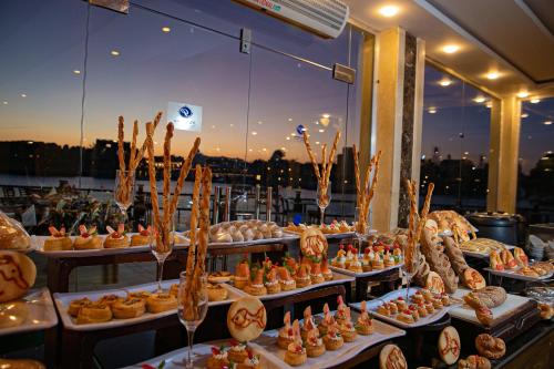 a buffet of food on display in a restaurant at Panorama Bungalows Resort El Gouna in Hurghada