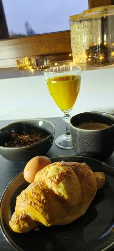 a plate with an omelet and eggs and a drink at Red Room Luxury puhkemaja 