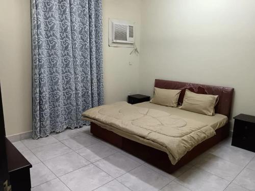Llit o llits en una habitació de بناية هند