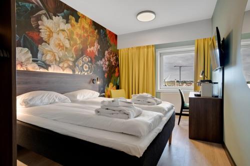 Ένα ή περισσότερα κρεβάτια σε δωμάτιο στο Thon Partner Hotel Saga