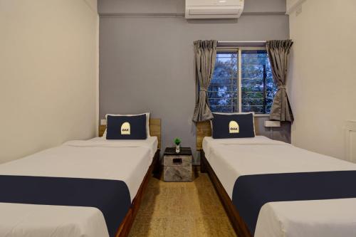 En eller flere senge i et værelse på Super Collection O Grey House