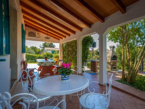 a patio with a table and chairs on a patio at Holiday Home Adele by Interhome in Labin