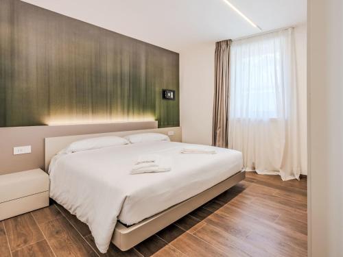 En eller flere senge i et værelse på Apartment Dolores-3 by Interhome