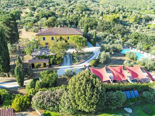 an aerial view of a house with a pool and trees at Apartment Erica by Interhome in Venturina Terme