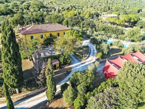 an aerial view of a house with a road and trees at Apartment Erica by Interhome in Venturina Terme