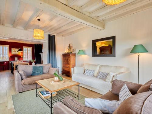 a living room with couches and a table at Holiday Home La Musardière by Interhome in Saint-Germain-des-Angles