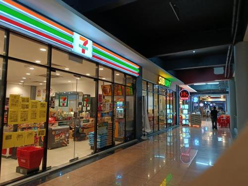 a store front of a shopping mall with glass windows at Modern Home surrounded with many Amenities in Donggongon