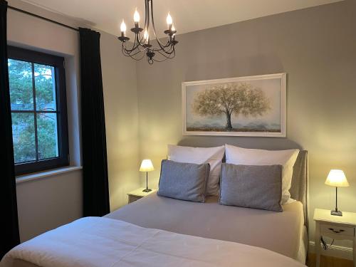 Кровать или кровати в номере OstseeVilla Seebad Ahlbeck Ferienwohnungen