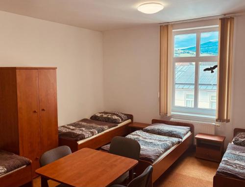 Ένα ή περισσότερα κρεβάτια σε δωμάτιο στο Ubytovani Rico