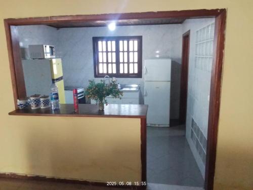 a kitchen with a counter and a refrigerator at Relax with the whole family in this accommodation in Belas