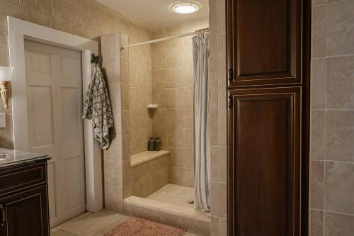 a bathroom with a shower with a shower curtain at Historic Home near Stony Brook Village & Beach in Stony Brook